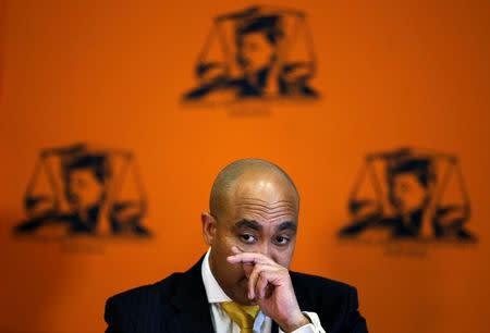 Head of the National Prosecuting Authority, Shaun Abrahams gestures as he announces the dropping of fraud charges on Monday against Finance Minister Pravin Gordhan, the latest twist in a police investigation that has rattled financial markets in the continent's most industrialised economy, during a media briefing, in Pretoria, South Africa, October 31,2016. REUTERS/Siphiwe Sibeko