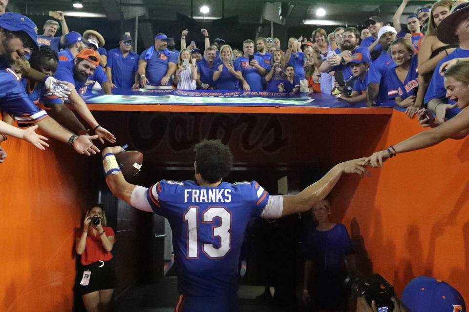 Florida quarterback Feleipe Franks greets fans as he leaves the field after Florida defeated LSU i27-19 in an NCAA college football game, Saturday, Oct. 6, 2018, in Gainesville, Fla. (AP Photo/John Raoux)