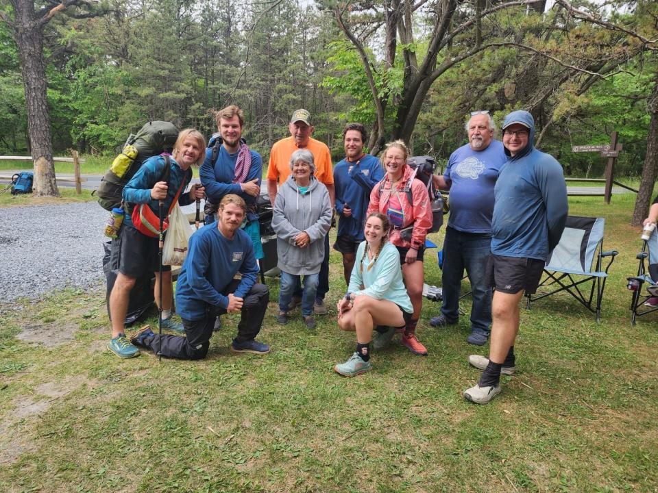 Alexis Holzmann poses alongside some of the members of her hiking group as they make their way north on the 2,200-mile trek.