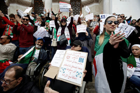 People with special needs, accompanied by their families, take part in a protest demanding immediate political change and improvement of their living conditions in Algiers, Algeria March 14, 2019. REUTERS/Ramzi Boudina