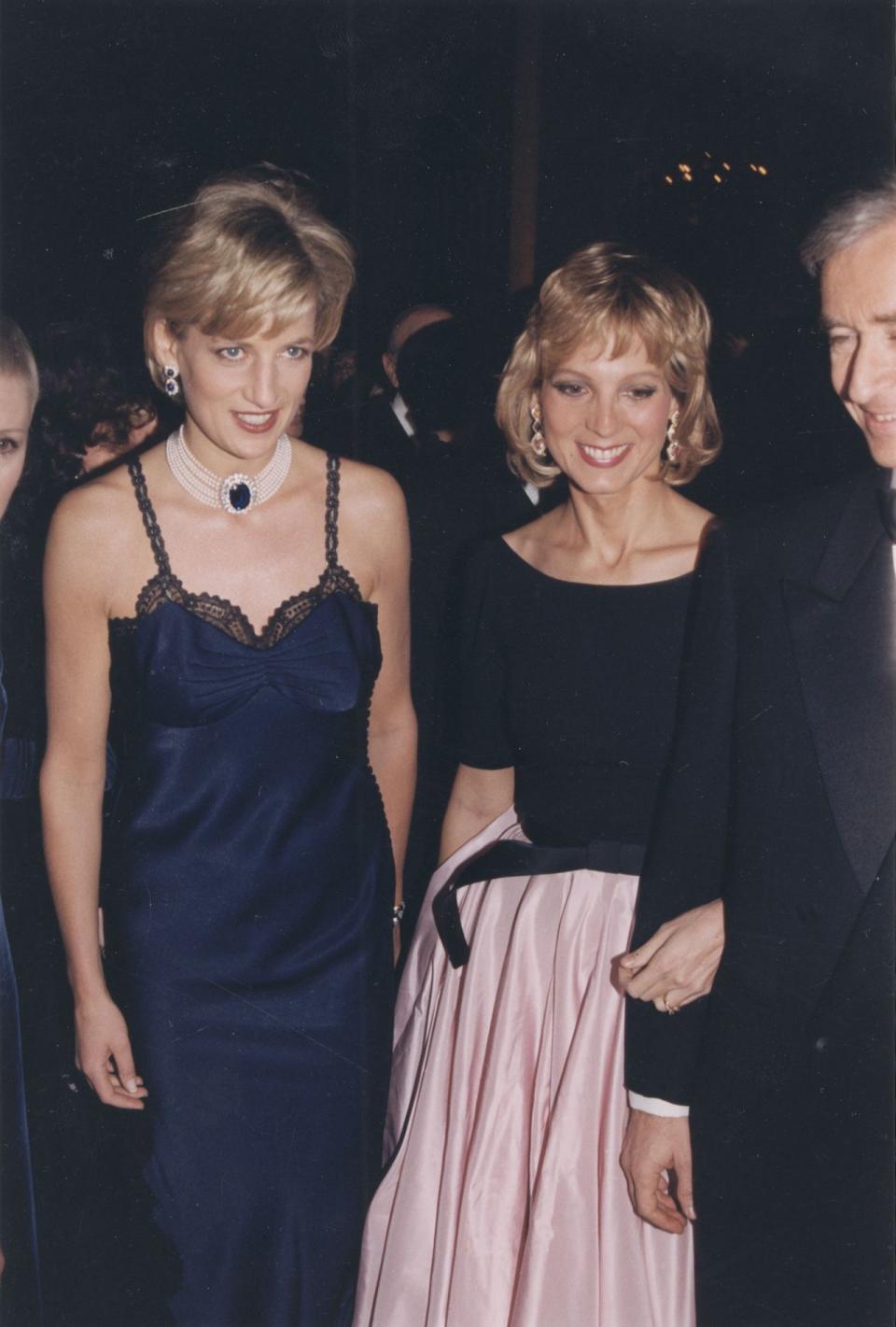 best dressed at met gala 1995, Princess Diana wearing a lace-trimmed slip dress and large pearl and sapphire. pendant at the Met Gala in New York and standing beside Helene Arnault in boat-neck blouse with a pale pink taffeta skirt on Jan. 1, 1995.

