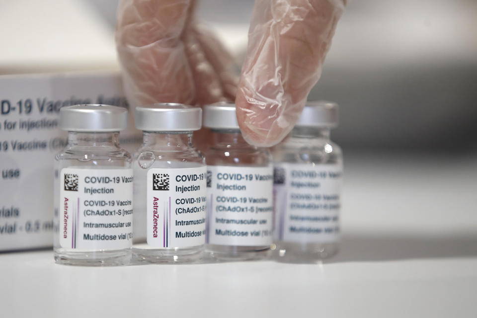 A health worker shows the media AstraZeneca vaccine vials at a vaccination center set up in front of Rome's Termini central station, Monday, March 8, 2021. (AP Photo/Alessandra Tarantino), Monday, March 8, 2021. (AP Photo/Alessandra Tarantino)