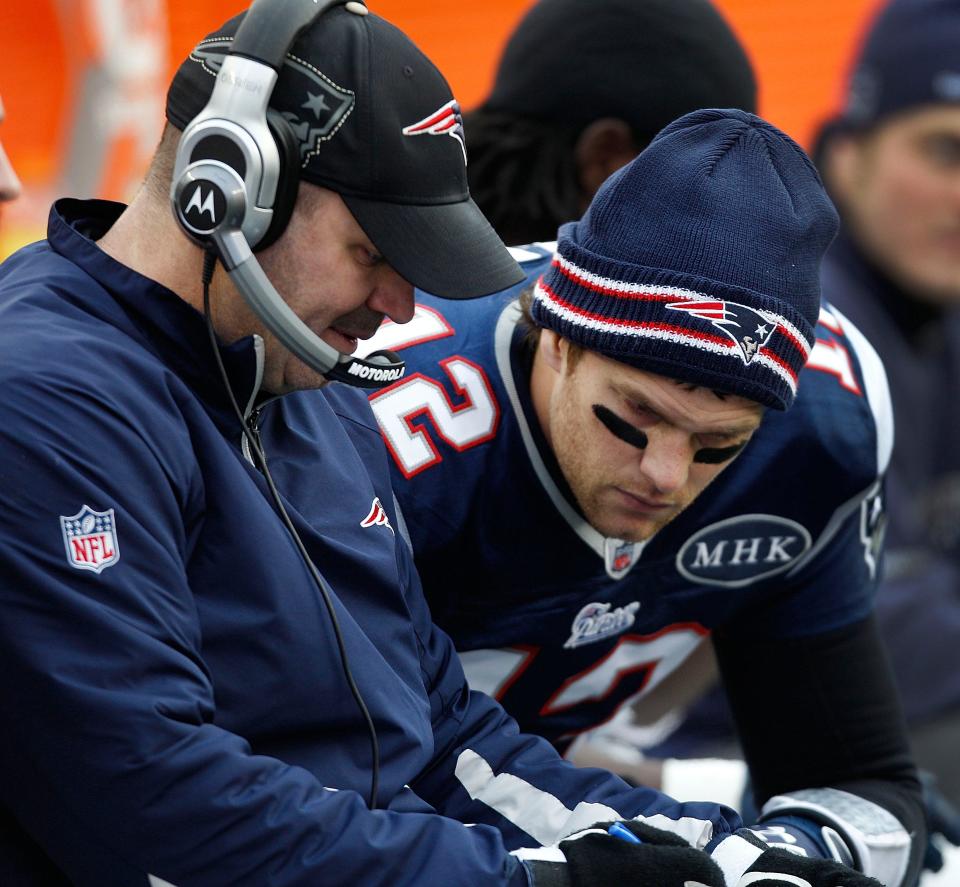 CORRECTS SPELLING TO O'BRIEN, INSTEAD OF O'BRIAN - New England Patriots offensive coordinator Bill O'Brien speaks with quarterback Tom Brady during the first half of the AFC championship NFL football game against the Baltimore Ravens on Sunday, Jan. 22, 2012, in Foxborough, Mass. (AP Photo/Charles Krupa)