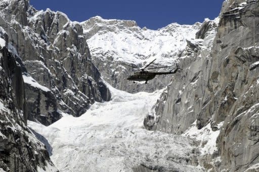 A Pakistan Army helicopter flies over the site of an avalanche near the Siachen glacier in April 2012. Pakistan's army chief of staff, General Ashfaq Kayani, has called for a negotiated end to the stalemate with India over the glacier and said it should be demilitarised after an avalanche on April 7 killed 140 people at a Pakistani army camp