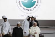 Pope Francis is flanked by Sheikh Ahmed el-Tayeb, the grand imam of Egypt's Al-Azhar as they arrive for an Interreligious meeting at the Founder's Memorial in Abu Dhabi, United Arab Emirates, Monday, Feb. 4, 2019. Pope Francis arrived in Abu Dhabi on Sunday. His visit represents the first papal trip ever to the Arabian Peninsula, the birthplace of Islam. (AP Photo/Andrew Medichini)