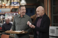 This image released by Fox shows Tim Allen, left, and Hector Elizondo in a scene from the comedy series "Last Man Standing," that aired on Thursday, March 19. With millions of people stuck at home due to the coronavirus outbreak, television viewership is on the rise. Broadcast networks see their 8 p.m. shows doing well in part, they suspect, because many are being shown after expanded local news. Fox's “Last Man Standing” last week, for example, was up 50 percent in live viewing, Nielsen said. (Michael Becker/Fox via AP)