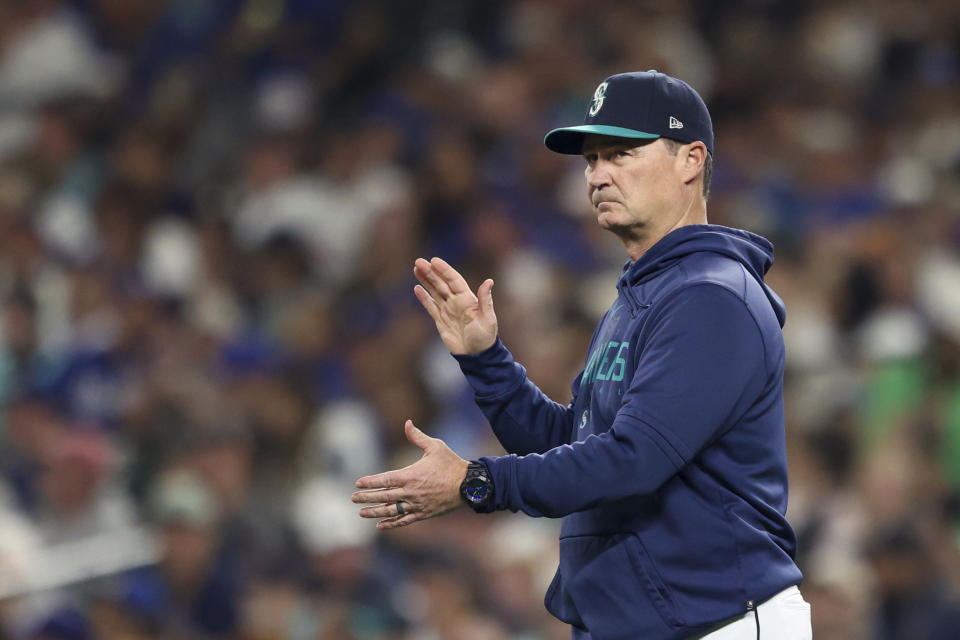 Seattle Mariners manager Scott Servais visits the mound during the sixth inning of a baseball game against the Los Angeles Dodgers, Saturday, Sept. 16, 2023, in Seattle. (AP Photo/Maddy Grassy)