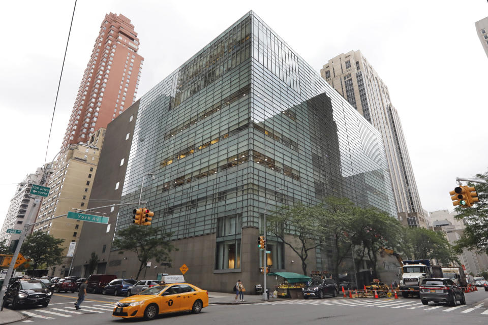 A taxi passes Sotheby's auction house, in New York, Monday, June 17, 2019. BidFair USA is taking auction house Sotheby's private in a deal valued at $3.7 billion. (AP Photo/Richard Drew)