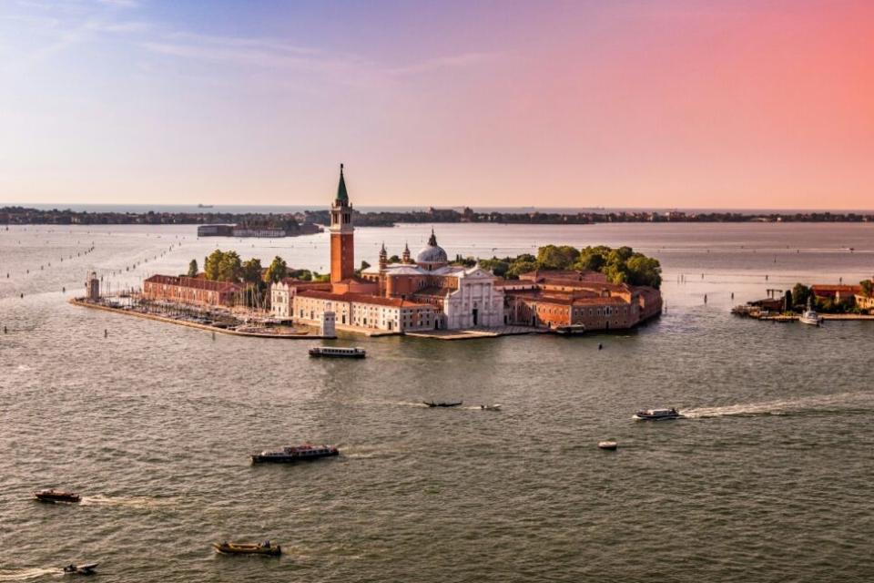 aerial view of boats in water near Venice, Italy at sunset