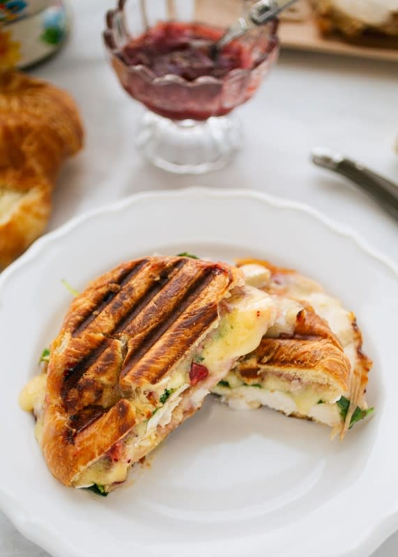 <p>Striped Spatula</p><p>A crisp, buttery turkey croissant panini with sliced Brie, cranberry relish and baby arugula is an easy way to enjoy your holiday leftovers. Great for lunch!</p><p><strong>Get the recipe: <a href="https://stripedspatula.com/turkey-croissant-panini/" rel="nofollow noopener" target="_blank" data-ylk="slk:Turkey Croissant Panini;elm:context_link;itc:0;sec:content-canvas" class="link ">Turkey Croissant Panini</a></strong></p>