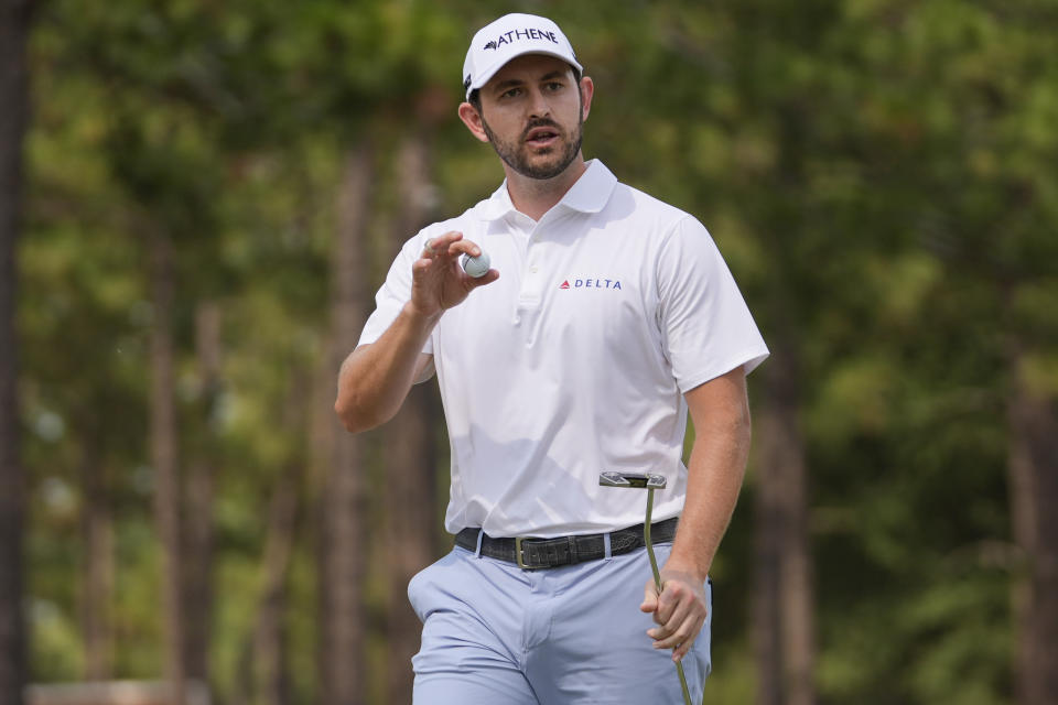 Patrick Cantlay waves after making a putt on the seventh hole during the final round of the U.S. Open golf tournament Sunday, June 16, 2024, in Pinehurst, N.C. (AP Photo/Frank Franklin II)