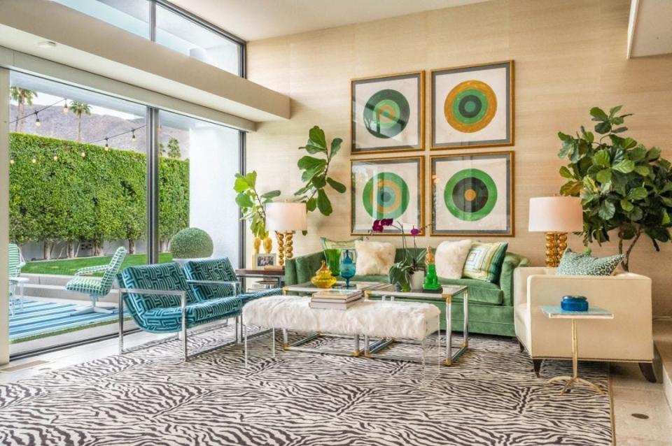 A bold blue and green color palette is seen throughout the Seventies Sackley home.