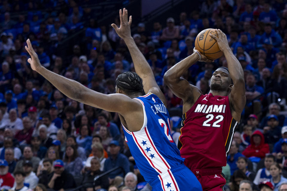 Miami Heat's Jimmy Butler, right, shoots as he is fouled by Philadelphia 76ers' Joel Embiid during the first half of an NBA basketball play-in tournament game Wednesday, April 17, 2024, in Philadelphia. (AP Photo/Chris Szagola)