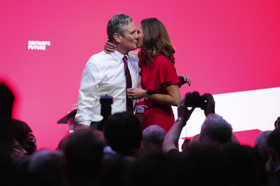 Britain's opposition Labour Party leader Keir Starmer kisses his wife Victoria after he delivers his keynote speech at the Labour Party conference in Liverpool, England, Tuesday, Oct. 10, 2023.(AP Photo/Jon Super)