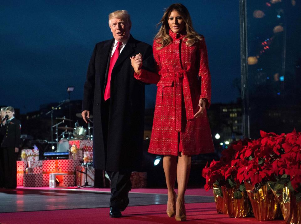 <p>President Donald Trump and First Lady Melania Trump walk off the stage during the 95th annual National Christmas Tree Lighting ceremony at the Ellipse in President’s Park near the White House in Washington on Nov. 30, 2017. (Photo: Nicholas Kamm/AFP/Getty Images) </p>