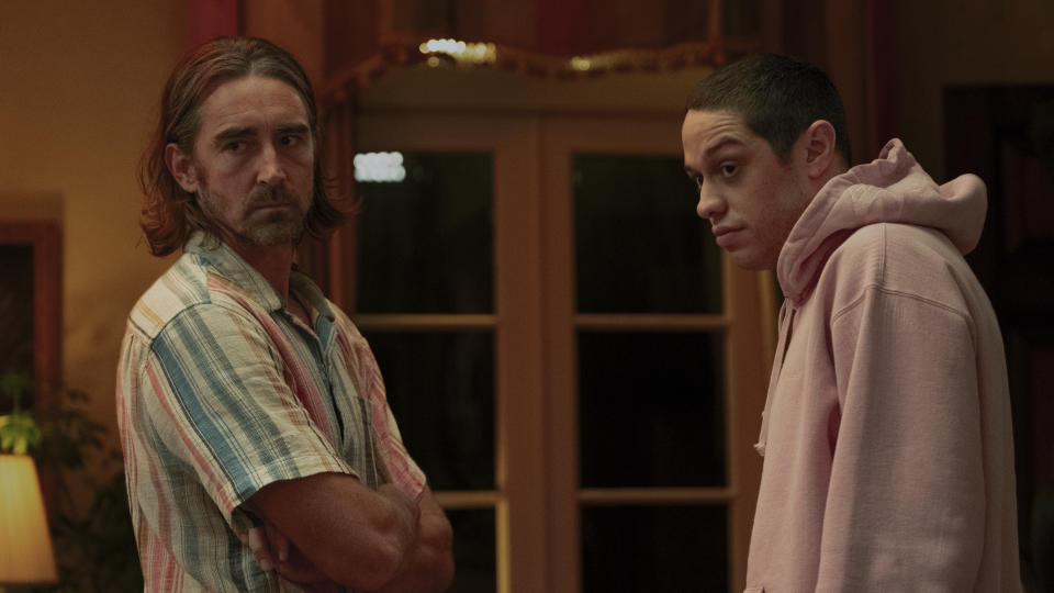 This image released by A24 shows Lee Pace, left, and Pete Davidson in a scene from "Bodies Bodies Bodies." (A24 via AP)