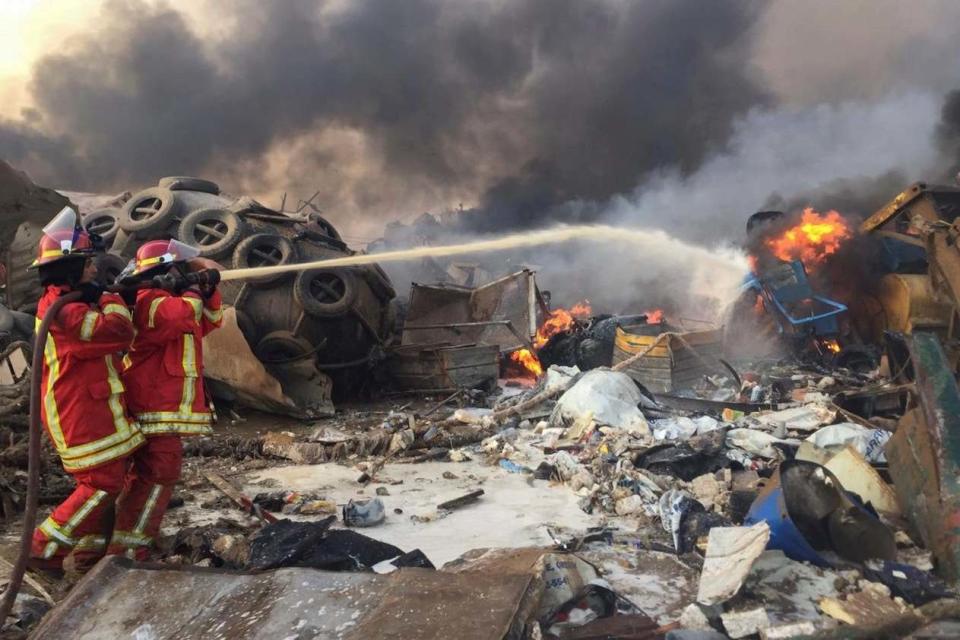 Firefighters battle a blaze caused by the explosion (REUTERS)