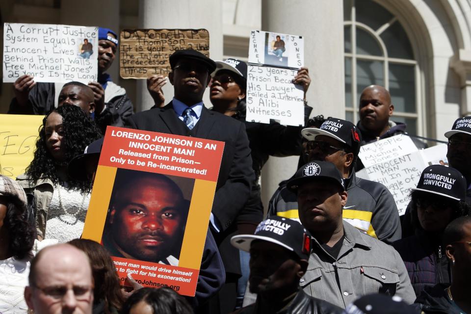 Family members of inmates who claim they were wrongfully convicted gather to show support as a group of New York City men, who claim they were framed by a crooked police detective decades ago, voice their demand for prosecutors to speed up an ongoing review of the detective's cases at a rally on the steps of City Hall, Wednesday, April 9, 2014, in New York. They claim they were convicted on evidence fabricated by the now-retired detective, Louis Scarcella. (AP Photo/Jason DeCrow)