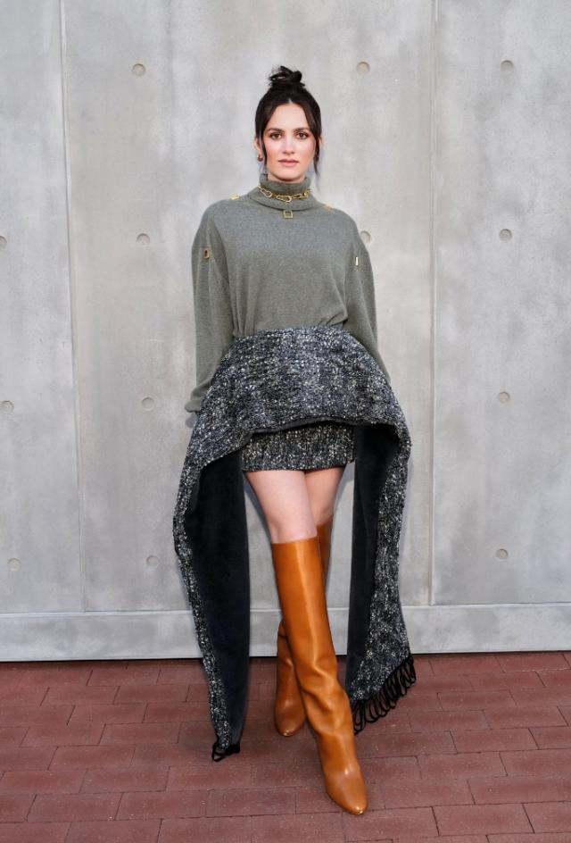 Chloe Grace Moretz looks edgy in a black leather miniskirt at the Louis  Vuitton pre-fall 2023 show