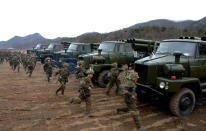 <p>North Korean soldiers run as they attend military training in an undisclosed location in this picture released by the North’s official KCNA news agency in Pyongyang March 11, 2013. (KCNA/Reuters) </p>