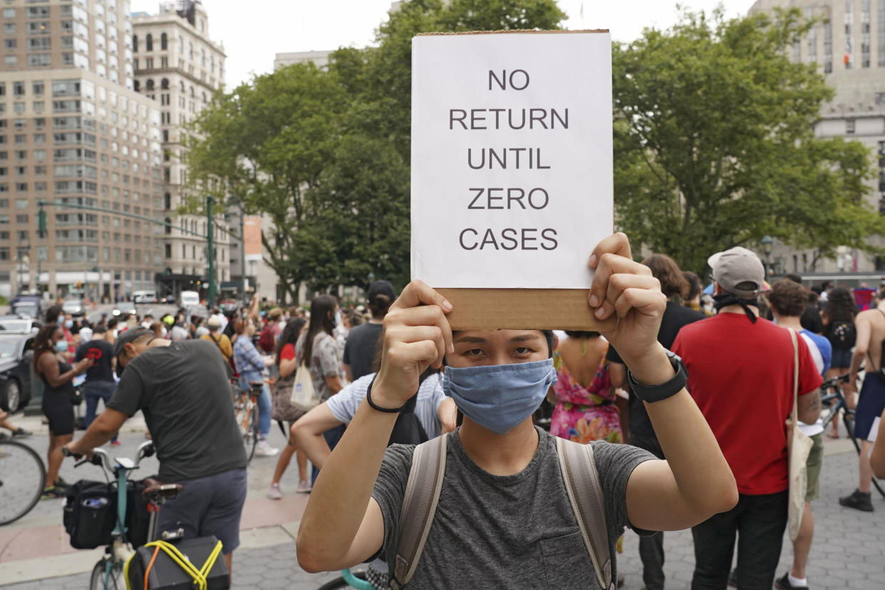 NEW YORK, UNITED STATES - 2020/08/03: A protester holds a placard that says No return until zero cases during the demonstration. Black Lives Matter, UFT United federation of teachers (union), the Democratic Socialists of America, and other groups gathered on the National Day of Resistance to protest against reopening of schools as well as police-free schools. (Photo by Ron Adar/SOPA Images/LightRocket via Getty Images)