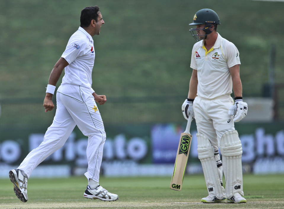 Pakistan's Mohammad Abbas celebrates the dismissal of Australia's Travis Head in their cricket test match in Abu Dhabi, United Arab Emirates, Friday, Oct. 19, 2018. (AP Photo/Kamran Jebreili)