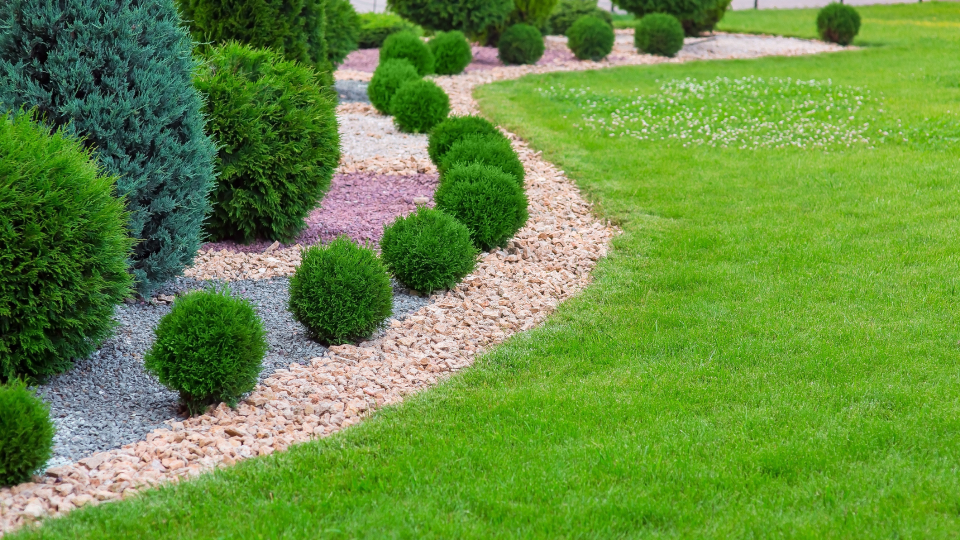 Rocks are a safe choice when landscaping and will act as a mini barrier for your home.