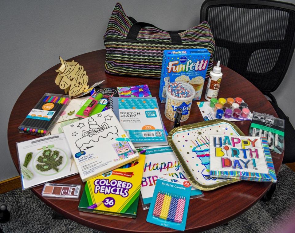 Giving Birthdays provides a birthday box filled with party items and hand-selected gifts to children in foster and kinship care. Shown here are the contents of a birthday box for a girl who wished for art supplies for her birthday.