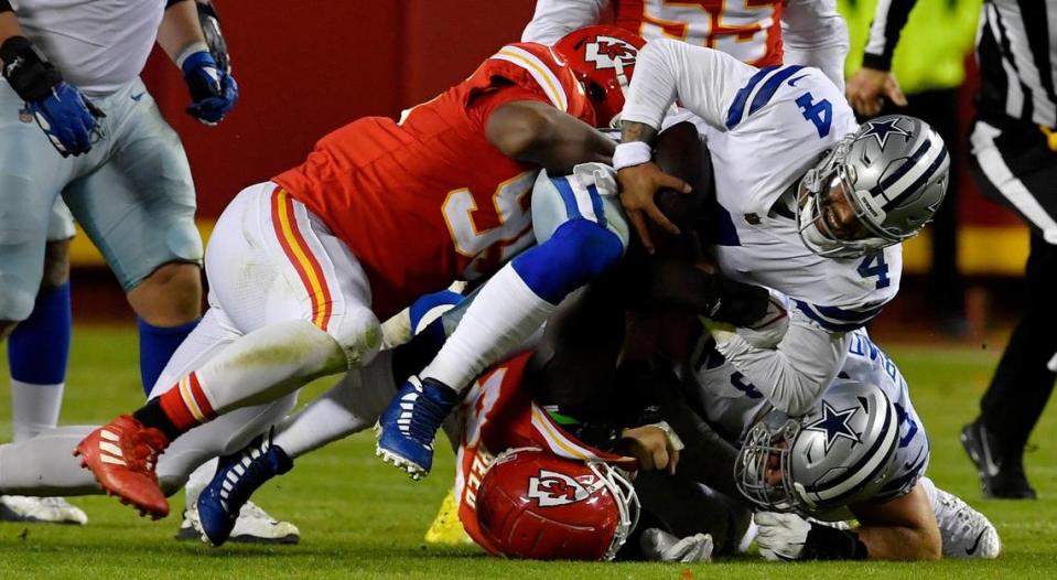 Kansas City Chiefs defensive tackle Chris Jones, left, sacks Dallas Cowboys quarterback Dak Prescott during the fourth quarter of Sunday’s NFL game at Arrowhead Stadium. Kansas City beat Dallas, 19-9.