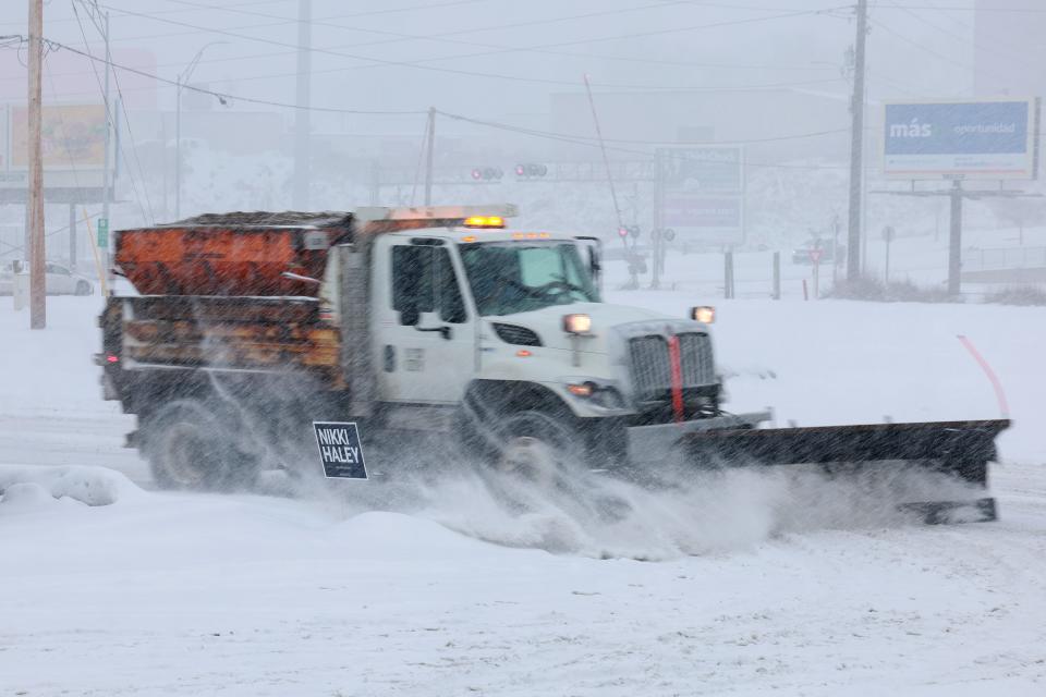 A snowplow clears the parking lot outside the Horizon Family Restaurant on Jan. 8, 2024, in Sioux City, Iowa.