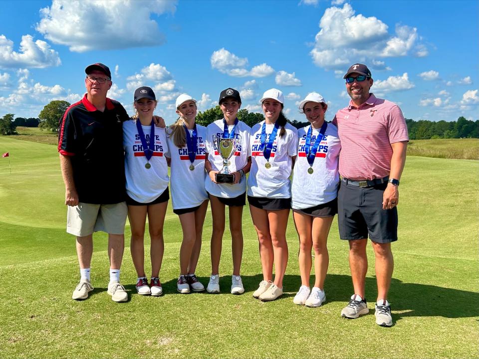The North Oconee girls golf team celebrates its state championship title victory.