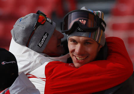 Alpine Skiing - Pyeongchang 2018 Winter Olympics - Men's Slalom - Yongpyong Alpine Centre - Pyeongchang, South Korea - February 22, 2018 - Michael Matt of Austria is embraced. REUTERS/Leonhard Foeger