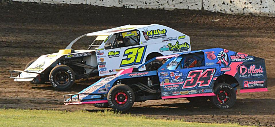 Midwest modified drivers Scott Hansen of Garden City (31) and Derek Rieck of Ortonville, Minn. (34J) are pictured during a Midwest modified heat race at Casino Speedway on Sunday, July 16, 2023. Hansen closed out the night by winning the feature in the class.
