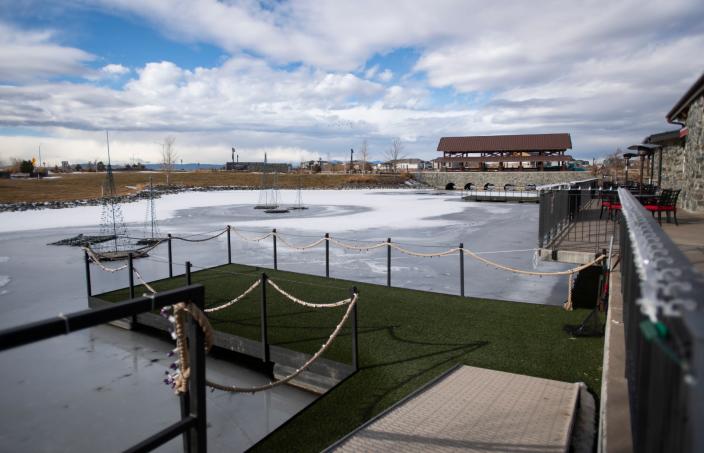 In this file photo, ice covers the pond in front of Ted&#39;s Grill at RainDance in Windsor on Jan. 5, 2021.