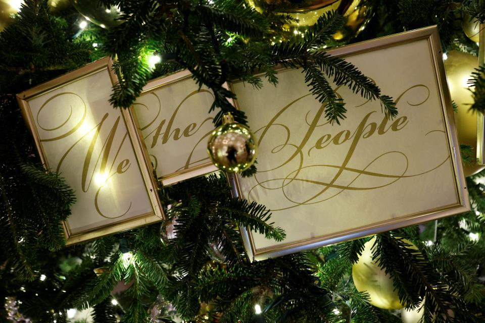 Ornaments on a White House Christmas tree reading "We the people"