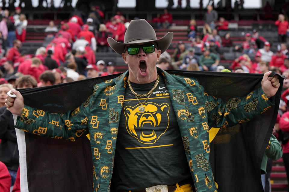 A Baylor fan celebrates following an NCAA college football game against Cincinnati, Saturday, Oct. 21, 2023, in Cincinnati. (AP Photo/Jeff Dean)