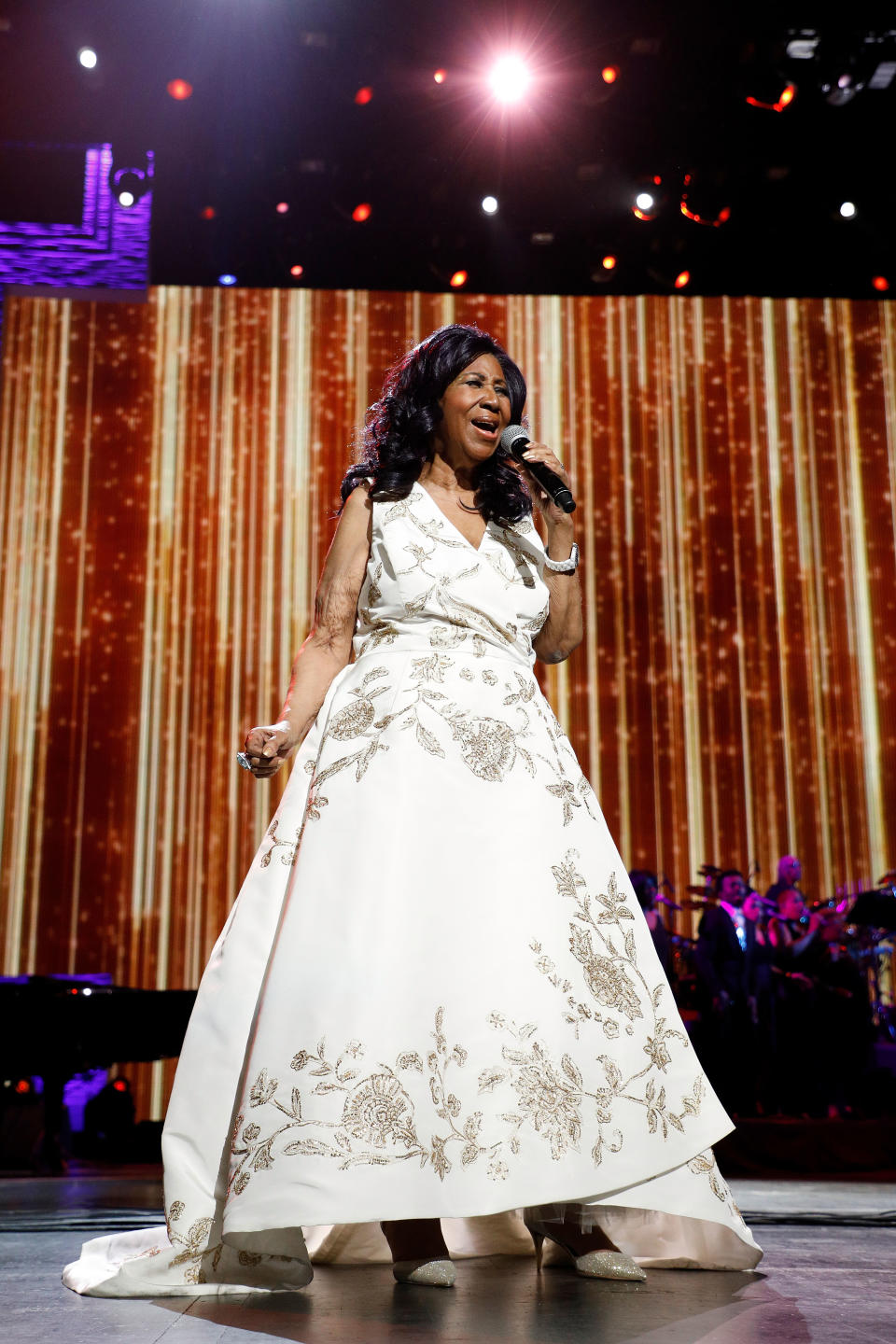 <p>Aretha Franklin wearing a glamorous white and gold A-line gown while performing at the 2017 Tribeca Film Festival Opening Gala premiere of “Clive Davis: The Soundtrack of Our Lives.” (Photo by Taylor Hill/Getty Images) </p>
