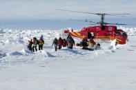 A helicopter from the Xue Long (Snow Dragon) Chinese icebreaker unloads rescued passengers from the ice-bound Russian ship, Akademik Shokalskiy, in East Antarctica, some 100 nautical miles (185 km) east of French Antarctic station Dumont D'Urville and about 1,500 nautical miles (2,800 km) south of Hobart, Tasmania, January 2, 2014, in this handout courtesy of Fairfax's Australian Antarctic Division. A rescue effort to remove 52 passengers on board a research ship that had been trapped in Antarctica ice for nine days was successful, and they were evacuated safely by helicopter, the expedition leader said on Thursday. A helicopter from the Chinese icebreaker Snow Dragon ferried the passengers in small groups several times from the Russian ship and transferred them to an Australian Antarctic supply ship, the Aurora Australis. Picture taken January 2, 2014. REUTERS/Fairfax/Australian Antarctic Division/Handout via Reuters (ANTARCTICA - Tags: ENVIRONMENT DISASTER) NO SALES. NO ARCHIVES. FOR EDITORIAL USE ONLY. NOT FOR SALE FOR MARKETING OR ADVERTISING CAMPAIGNS. THIS IMAGE HAS BEEN SUPPLIED BY A THIRD PARTY. IT IS DISTRIBUTED, EXACTLY AS RECEIVED BY REUTERS, AS A SERVICE TO CLIENTS