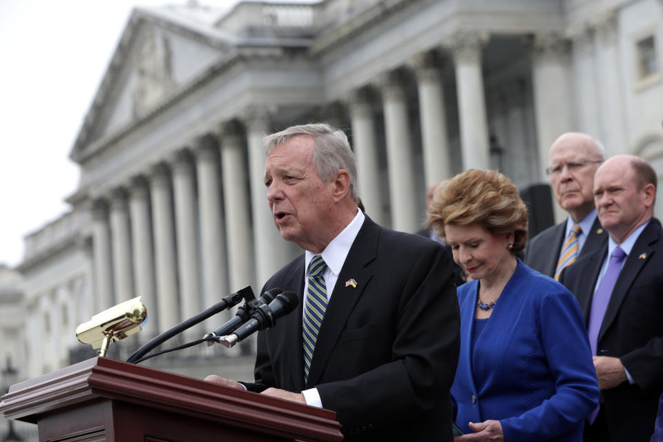 Sen. Dick Durbin, D-Ill., speaks at a lectern in front of the Capitol.