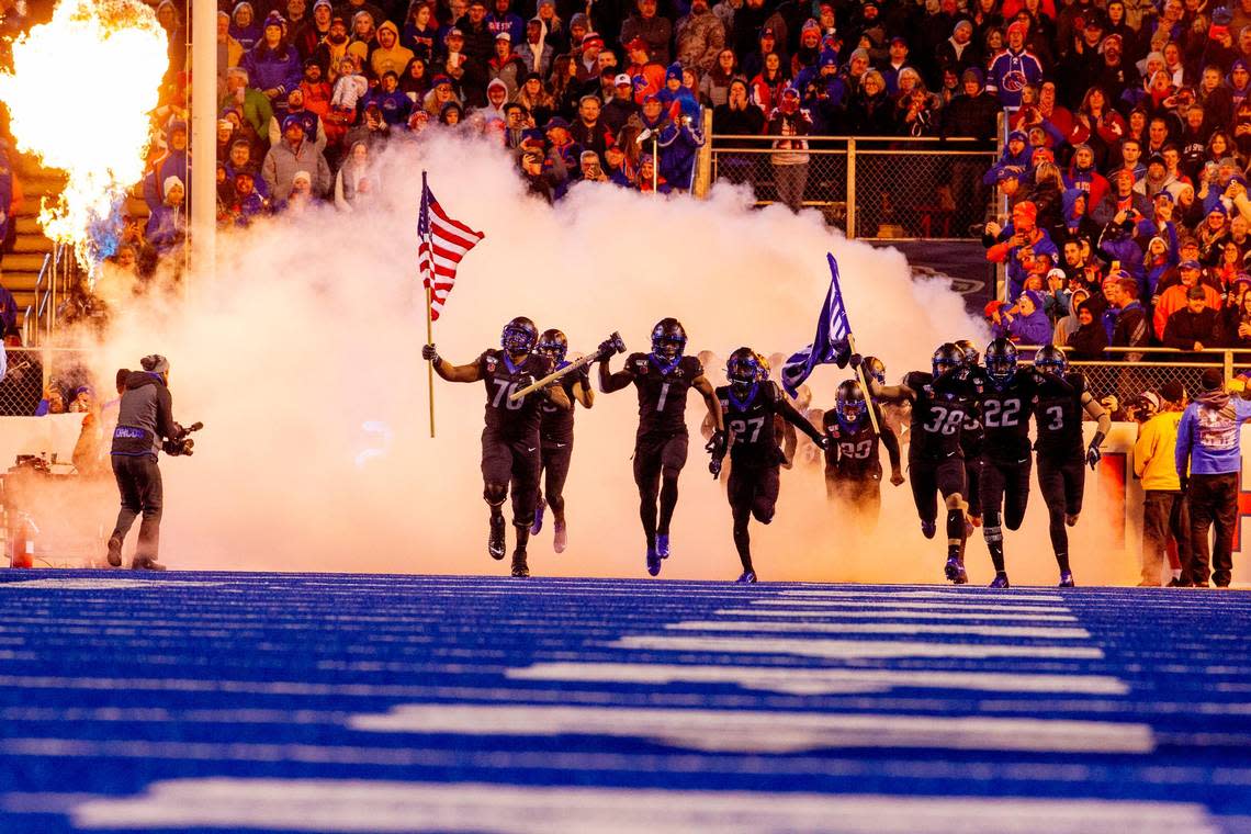 Boise State Broncos run onto the field before the game against Wyoming at Albertsons Stadium in Boise, Idaho. Boise State defeated Wyoming 20-17 in overtime. Kyle Green For The Idaho Statesman Saturday November, 09, 2019.