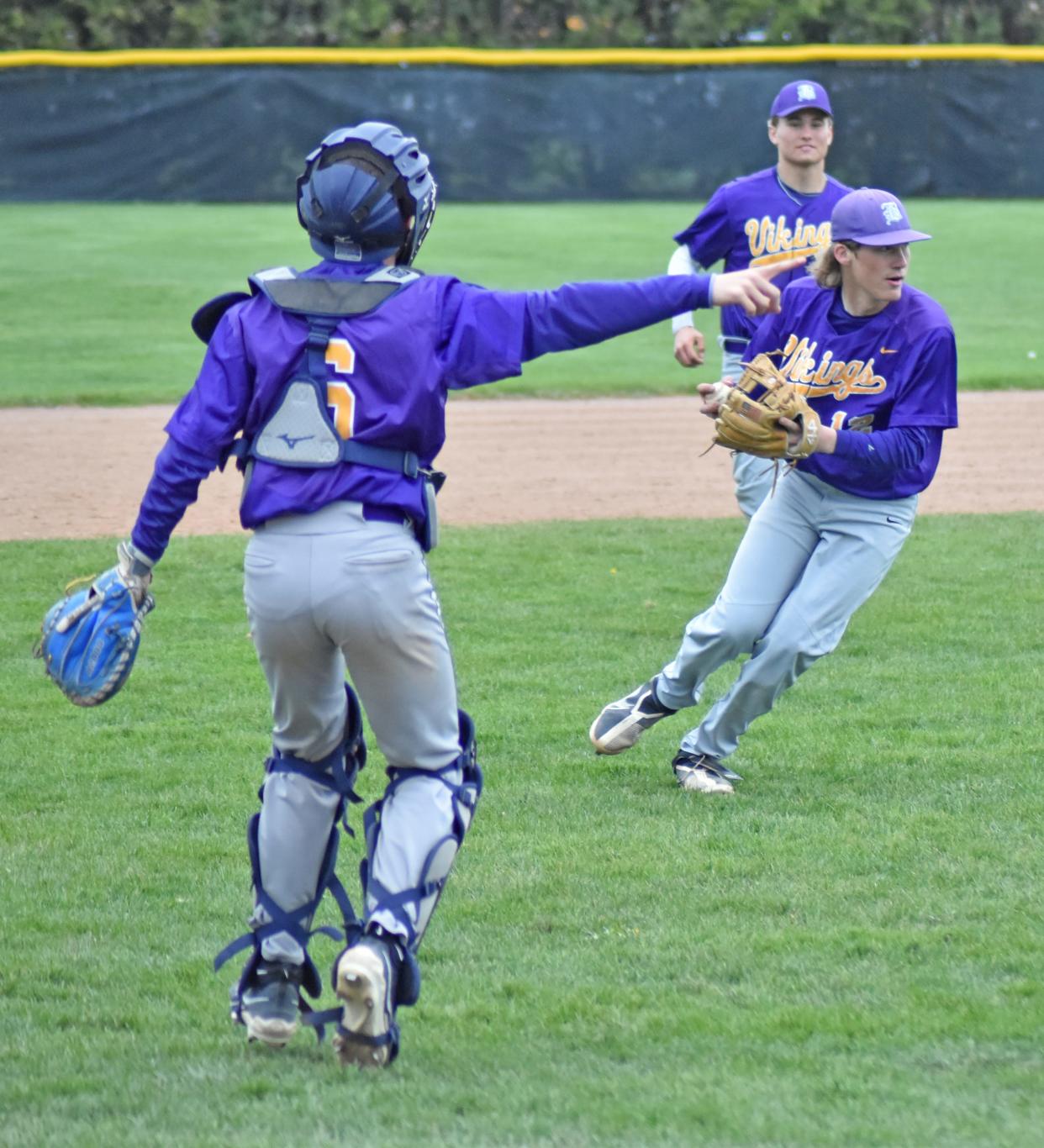 Bronson pitcher Kestin Goodman fields a bunt and gets direction from catcher Reid Sutkey