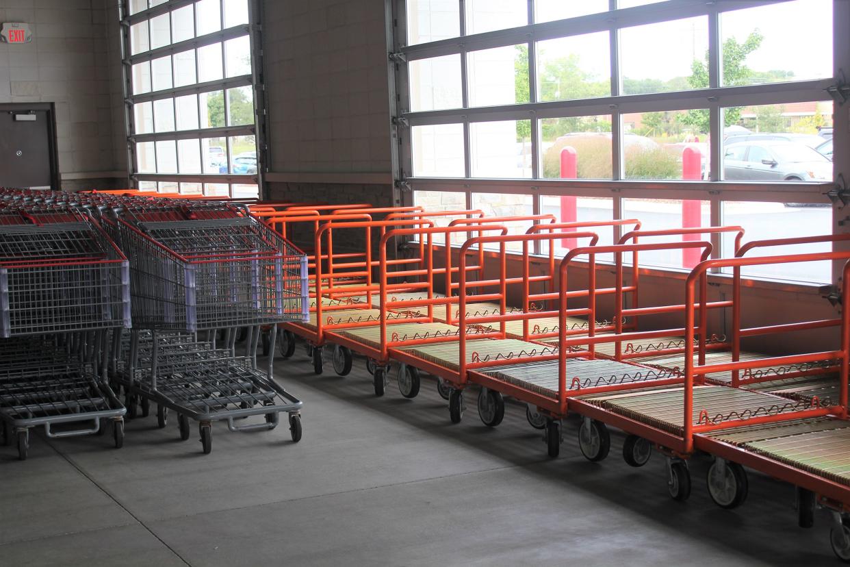 Flatbed and regular carts neatly stacked at Costco