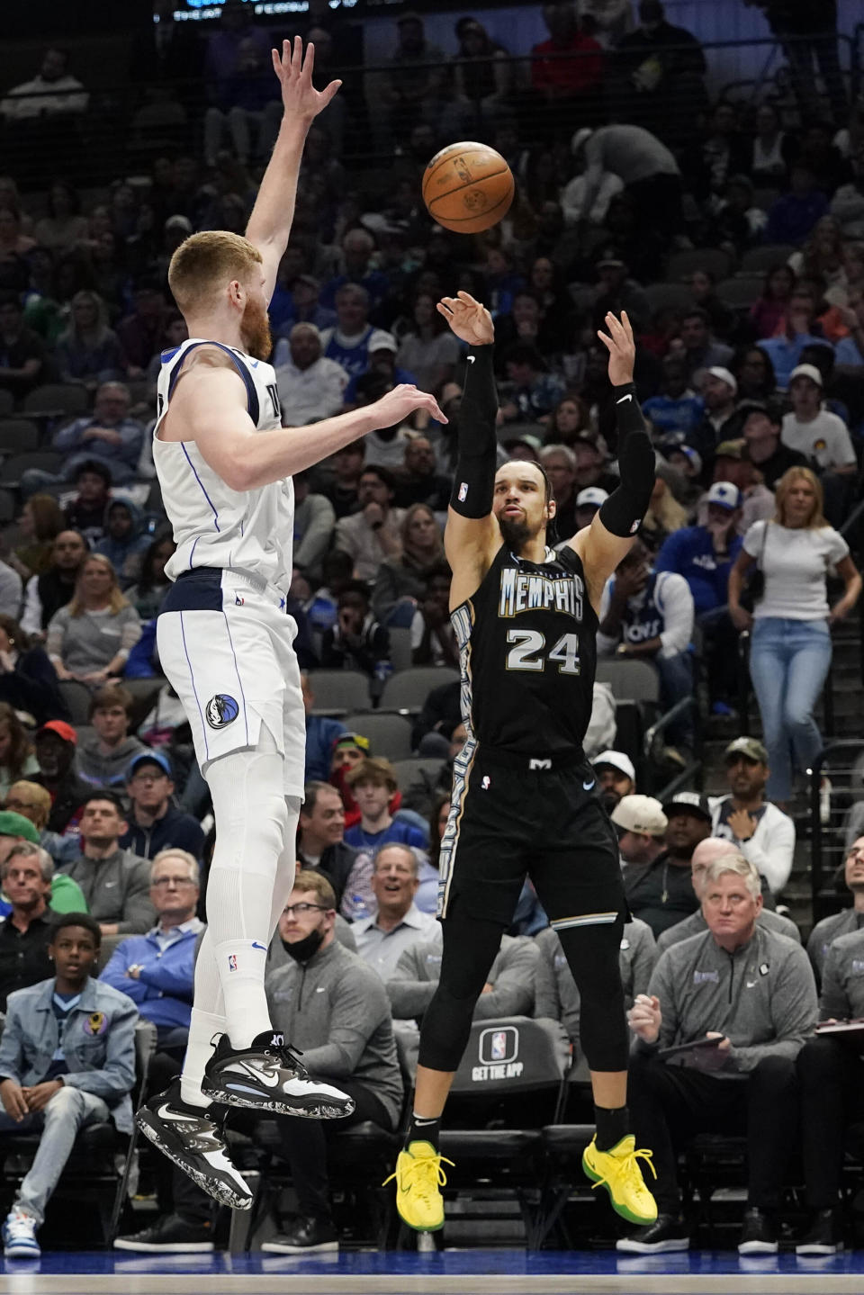 Memphis Grizzlies forward Dillon Brooks (24) shoots against Dallas Mavericks forward Davis Bertans during the second half of an NBA basketball game in Dallas, Monday, March 13, 2023. (AP Photo/LM Otero)