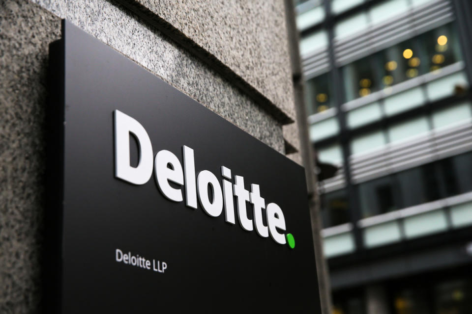 A Deloitte logo is pictured on a sign outside the company's offices in London on September 25, 2017. - Deloitte said Monday that 