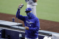 Los Angeles Dodgers right fielder Mookie Betts gestures as the Dodgers play the San Diego Padres during the second inning of a baseball game Wednesday, Aug. 5, 2020, in San Diego. (AP Photo/Gregory Bull)