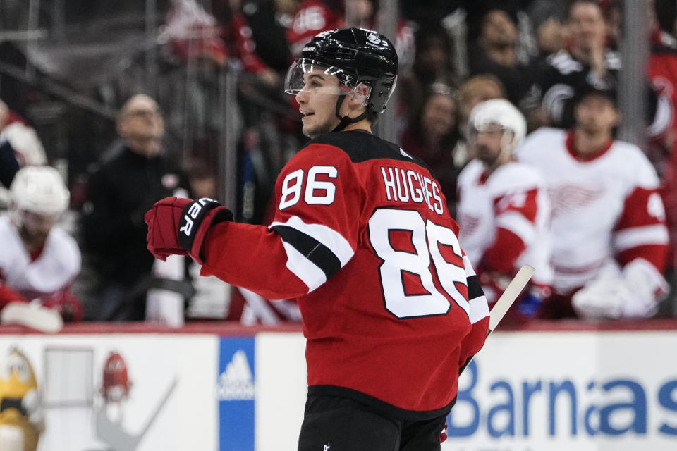 New Jersey Devils' Jack Hughes (86) celebrates a goal against the Detroit Red Wings during the second period of an NHL hockey game Thursday, Oct. 12, 2023, in Newark, N.J. (AP Photo/Frank Franklin II)