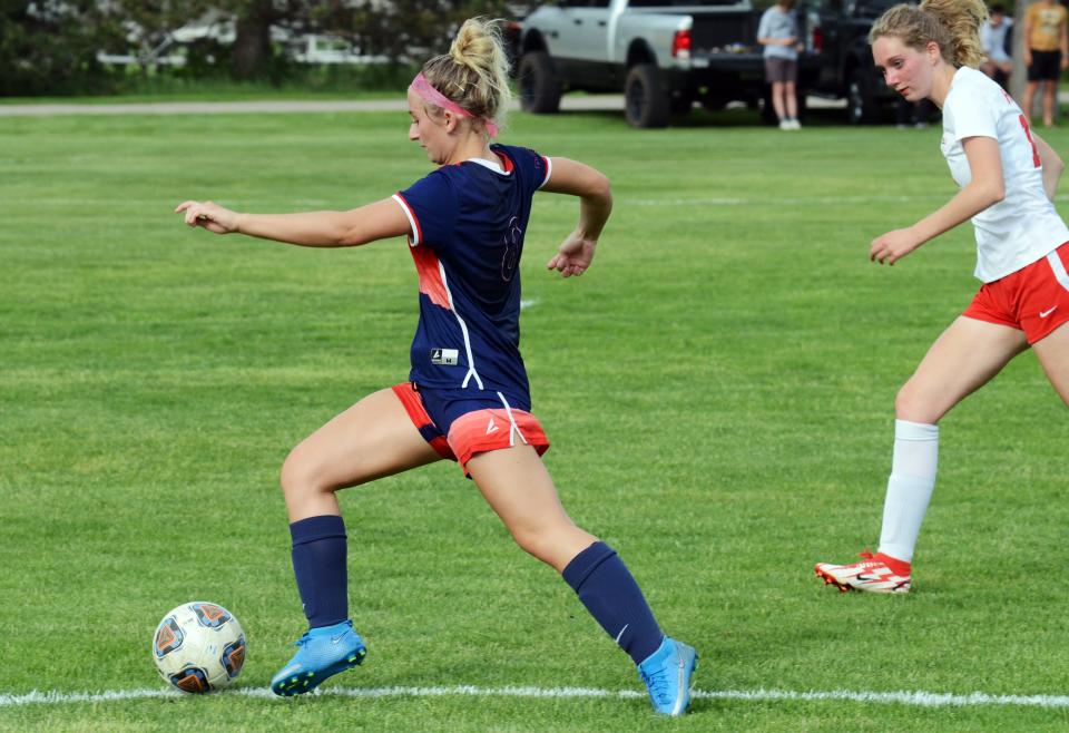 Boyne City's Ella Walsh pushes the ball down the sideline and past a Benzie Central defender in the first half Tuesday.