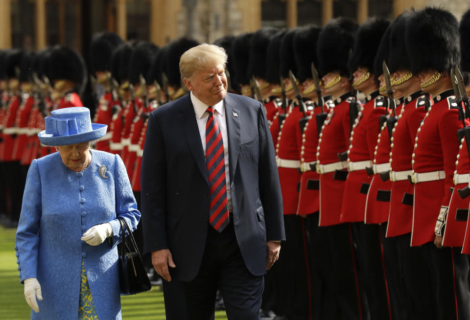 FILE - President Donald Trump and Queen Elizabeth II inspect a Guard of Honour, formed of the Coldstream Guards at Windsor Castle in Windsor, England, July 13, 2018. Queen Elizabeth II, Britain's longest-reigning monarch and a rock of stability across much of a turbulent century, died Thursday, Sept. 8, 2022, after 70 years on the throne. She was 96. (AP Photo/Matt Dunham, Pool, File)