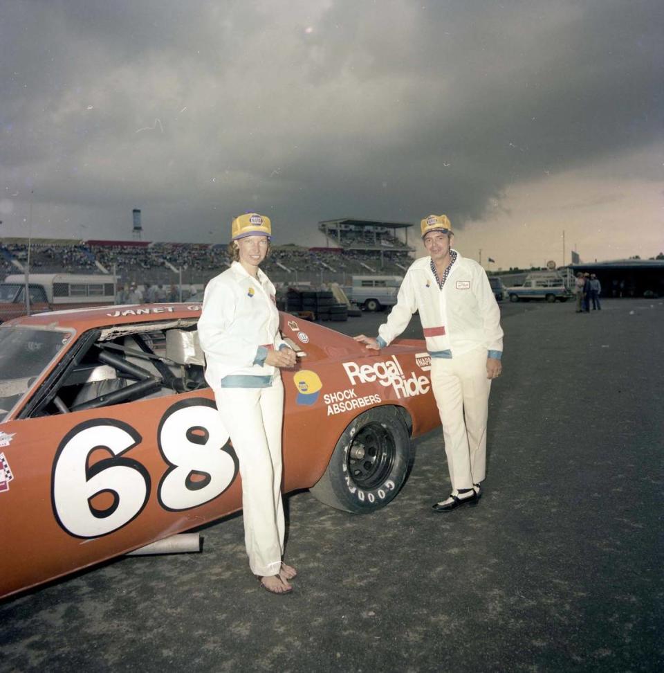 Janet Guthrie stands in front of the No. 68 racecar that Charlotte Motor Speedway officials helped her secure so she could drive in the 1976 World 600. She would finish 15th, beating future hall of fame drivers like Dale Earnhardt Sr. and Bill Elliott. The man standing to Guthrie’s right is unidentified.