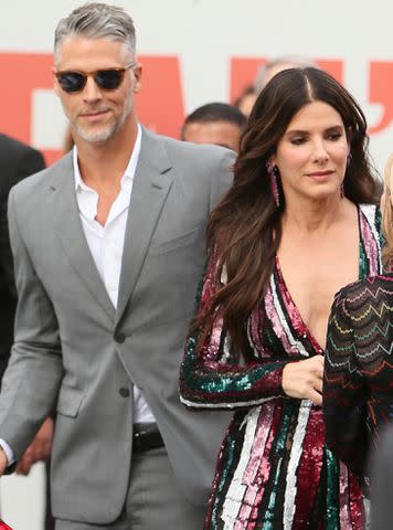 <p>Michael Wright/WENN.com/Alamy</p> Bryan Randall and Sandra Bullock in 2018